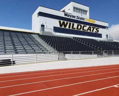 Stadium grandstand and press box with video scoreboard